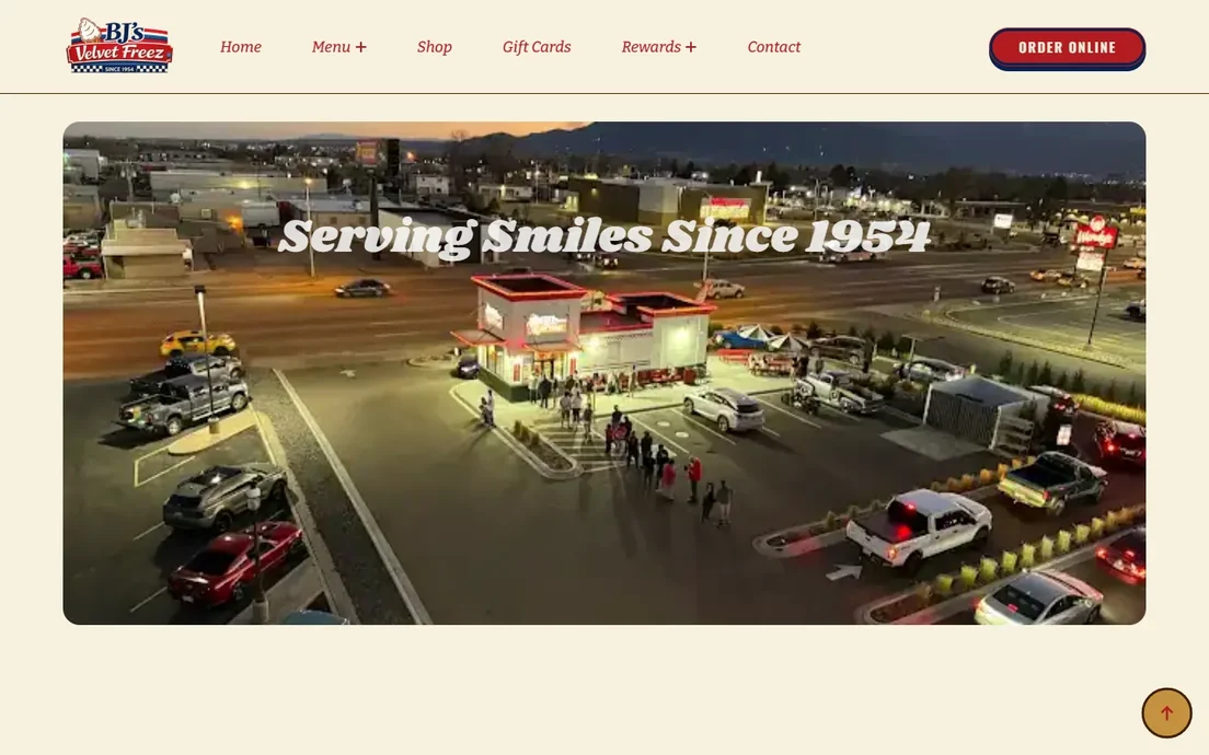 BJ's Velvet Freez homepage with an evening aerial of the drive-in under the headline Serving Smiles Since 1954