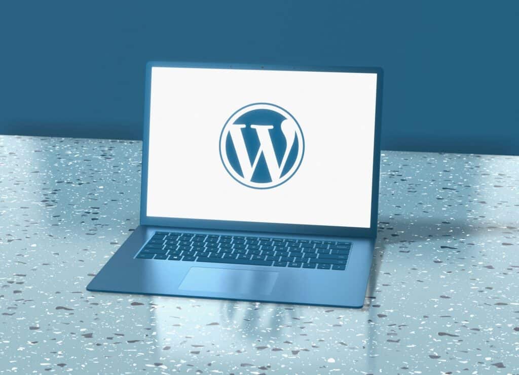 A laptop displaying the WordPress logo