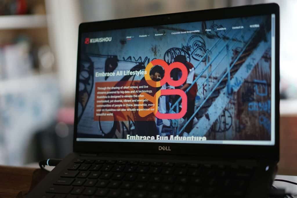 A laptop showing a live website homepage